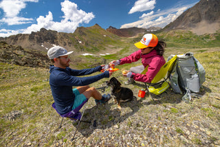 Sitting around the camp stove with friends