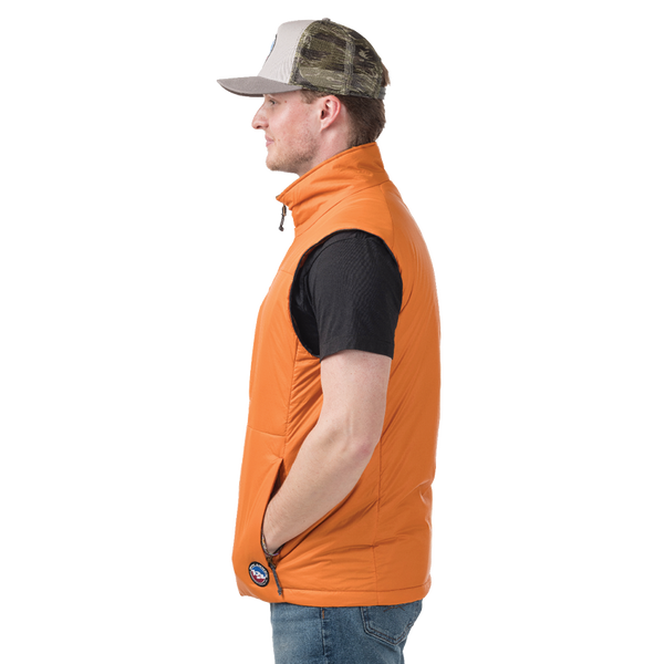 Side view of man wearing orange insulated vest with Big Agnes logo