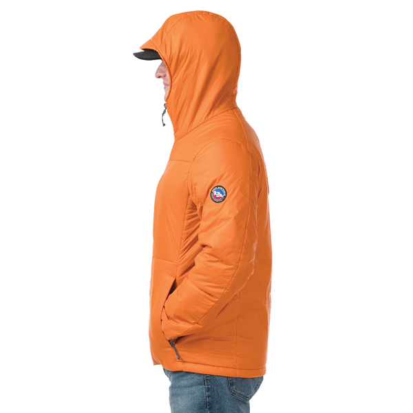 Side view of man standing in burnt orange jacket with Big Agnes logo