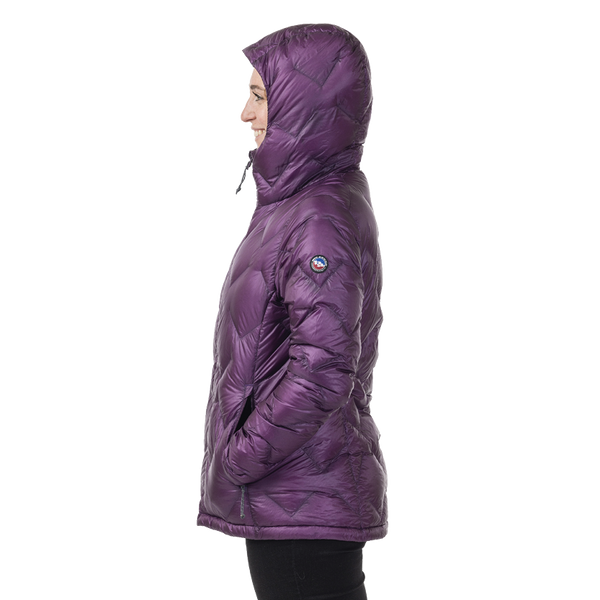 Side view of woman wearing dark purple geometric patterned hooded jacket