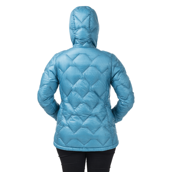 Rear view of woman wearing blue geometric patterned hooded jacket
