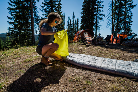 Inflating a sleeping pad