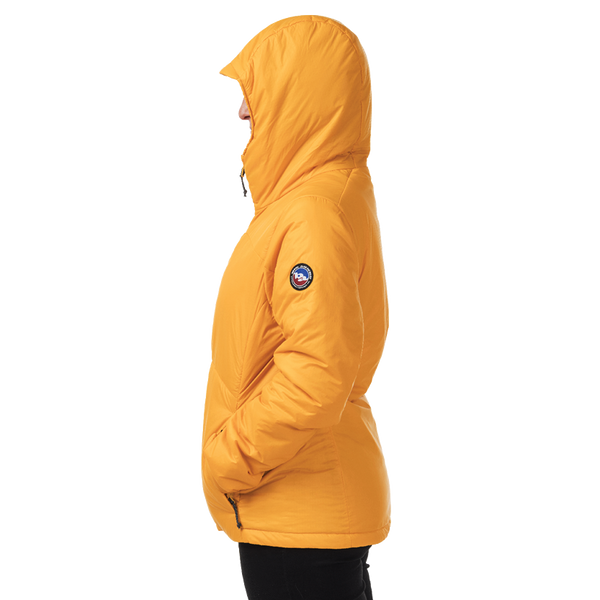 Side view of woman wearing yellow hooded jacket