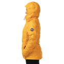Person wearing a mustard yellow quilted jacket on a white background