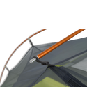 Close-up of a Tiger Wall UL2 Bikepack tent with an orange pole and gray fabric on a white background