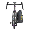 Bicycle with a black Tiger Wall UL Bikepack attached to the back on a white background