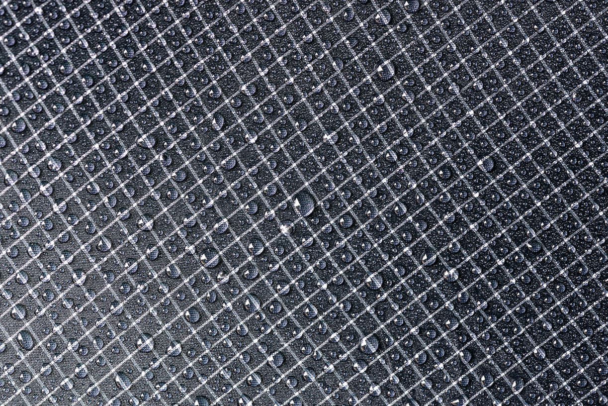 Textured black surface with a grid pattern