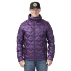 Man standing in a purple quilted puffer jacket