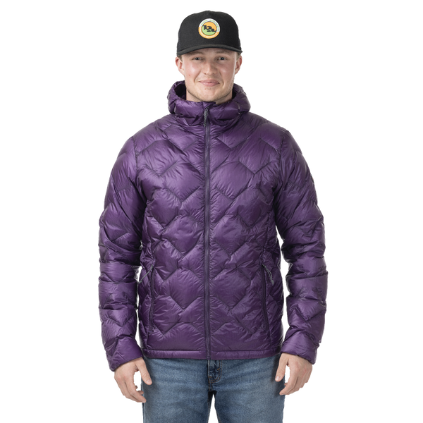 Man standing in a purple quilted puffer jacket