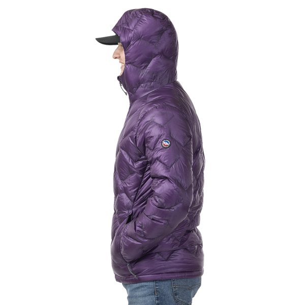 Person wearing a dark purple puffer jacket with a brand logo on a white background